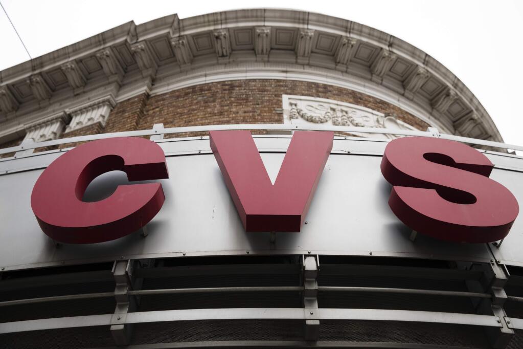 FILE - This Friday, Oct. 21, 2016, file photo shows a CVS drugstore and pharmacy location in Philadelphia. On Monday, Jan. 15, 2018, CVS said it will stop significant touchups of images used in its advertising for beauty products. (AP Photo/Matt Rourke, File)