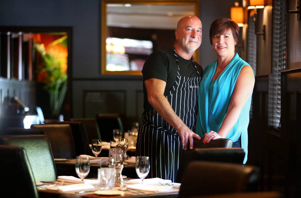 Mark and Terri Stark at Stark's Steak & Seafood, in Santa Rosa on Tuesday, July 8, 2014. The couple also owns Bravas Bar De Tapas, Willi's Wine Bar, Willi's Seafood & Raw Bar, and Monti's Rotisserie & Bar, and are getting ready to open a sixth restaurant in Sonoma County.(Christopher Chung/ The Press Democrat)