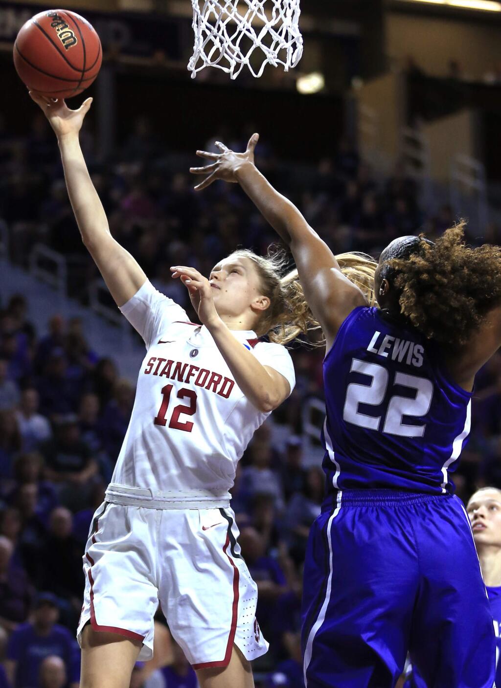 Stanford guard Brittany McPhee (12) makes a basket after getting past Kansas State forward Breanna Lewis (22) during the first half of a second-round game in the NCAA women's college basketball tournament in Manhattan, Kan., Monday, March 20, 2017. (AP Photo/Orlin Wagner)