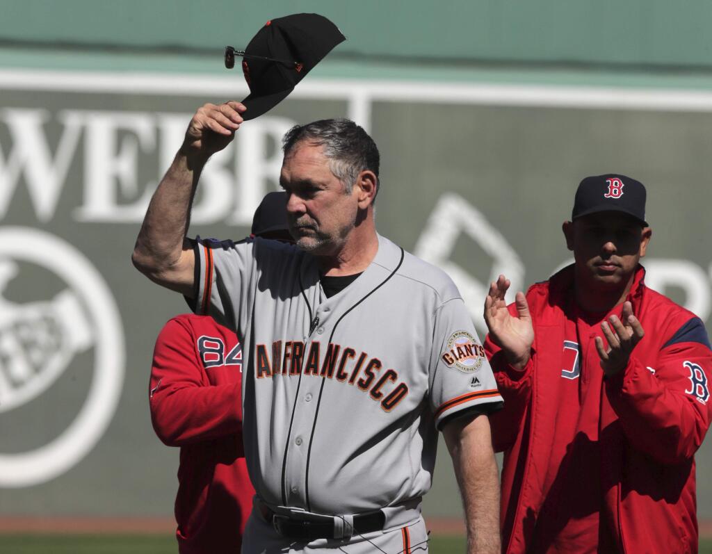 San Francisco Giants manager Bruce Bochy tips his cap as he is honored prior to a game against the Boston Red Sox at Fenway Park in Boston, Thursday, Sept. 19, 2019. (AP Photo/Charles Krupa)