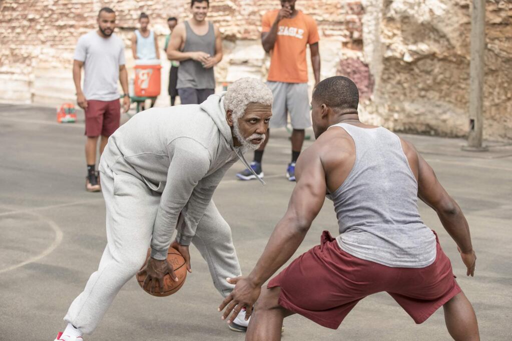 Boston Celtics star Kyrie Irving, left, plays one of a group of old basketball players asked to prove that they can still win the big one in 'Uncle Drew.' (Lionsgate)