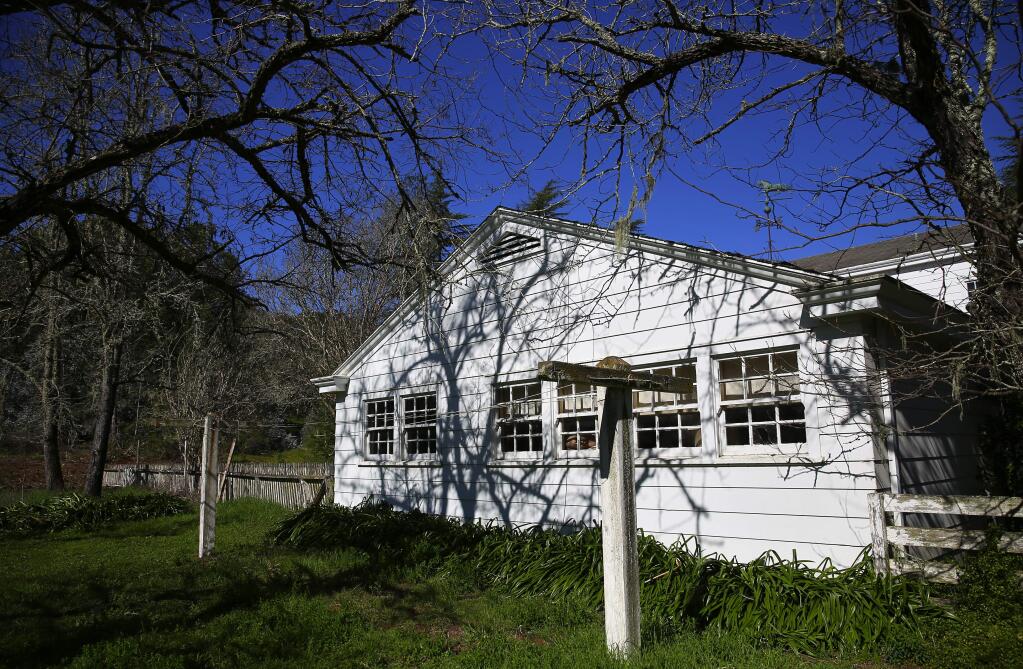 The rear of the 1951 neo-Colonial house bordering Spring Lake and Howarth Parks. (Christopher Chung/ The Press Democrat)