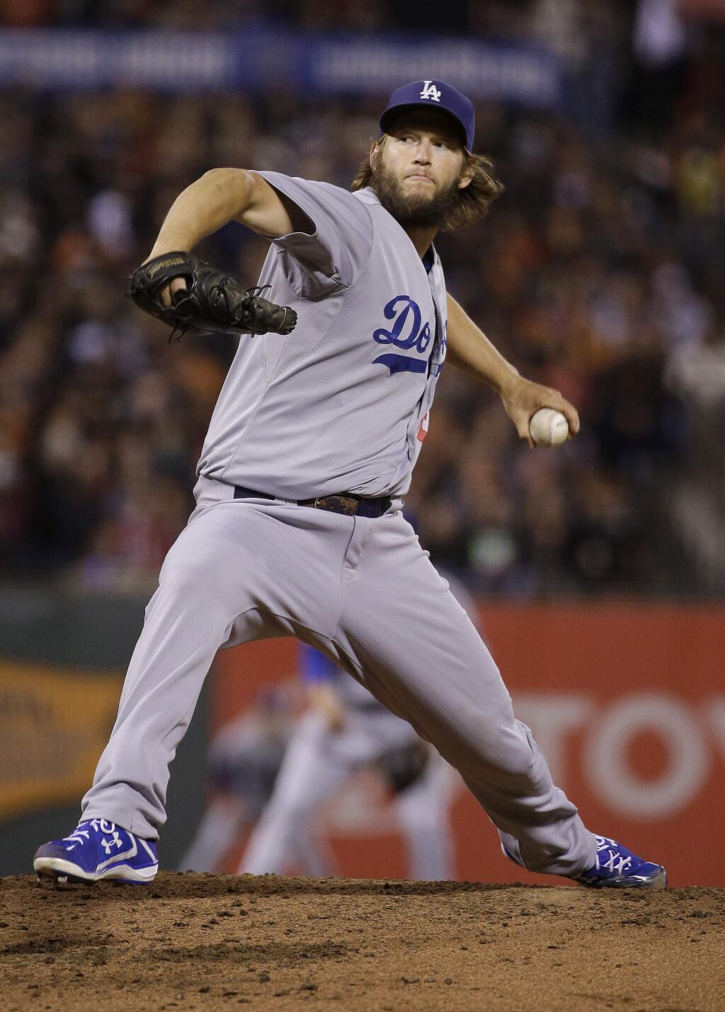 Los Angeles Dodgers pitcher Clayton Kershaw throws against the San Francisco Giants during the fourth inning of a baseball game in San Francisco, Tuesday, Sept. 29, 2015. (AP Photo/Jeff Chiu)