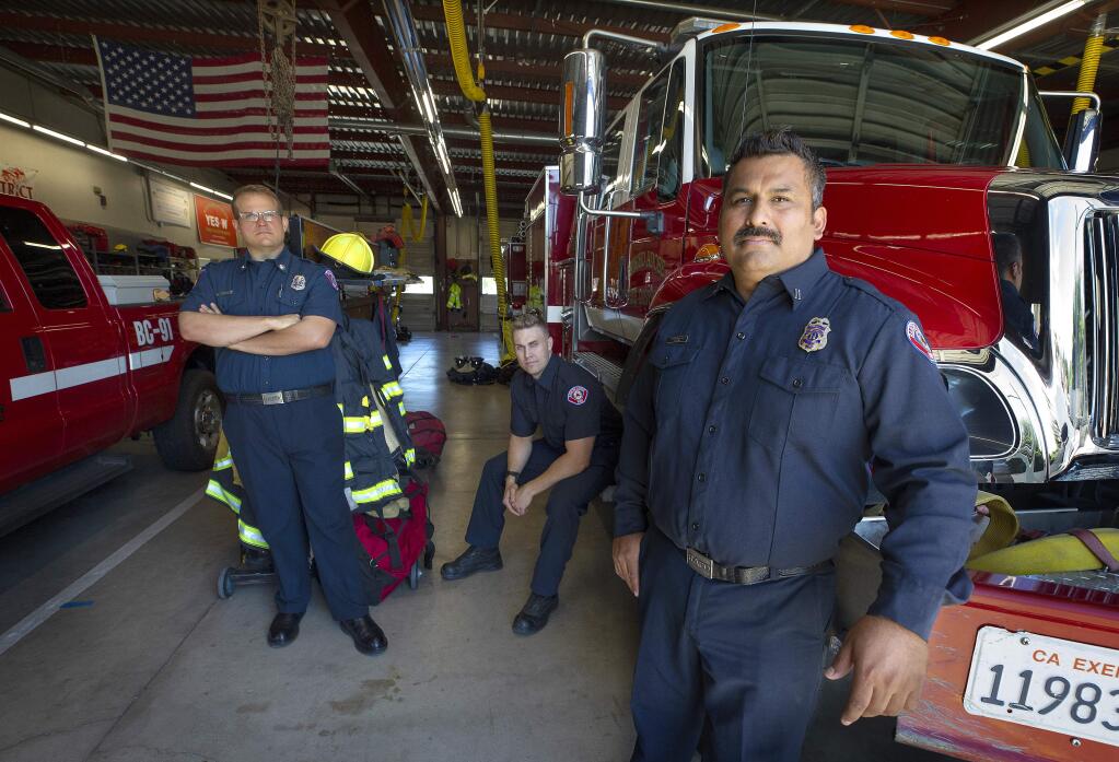 From right, Rancho Adobe Fire captain Jimmy Bernal and firefighters Hunter van Emmerik and Brian Sweet are among those concerned about growing data linking firefighting and cancer risk. Ten firefighters at their station were among the 149 local firefighters who gave blood and urine samples to test the toxicity of fighting the Tubbs fire. (John Burgess/The Press Democrat)