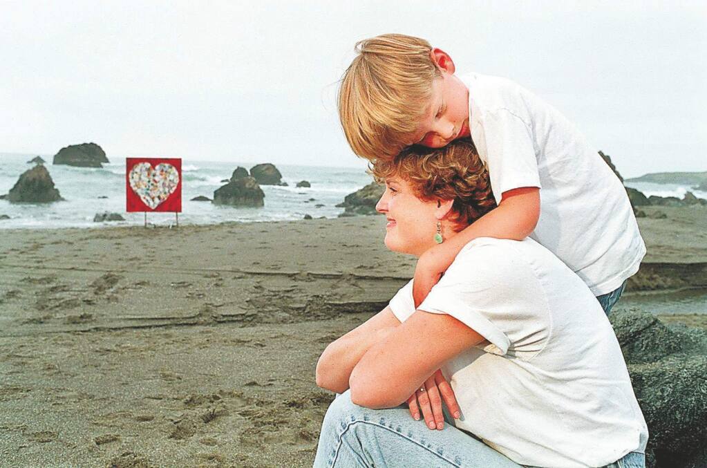 THE PRESS DEMOCRAT, FileNancy Witherell Bellen, with her son Wiley at her favorite beach north of Bodega Bay in 1996, after she was diagnosed with breast cancer. In the background is the heart collage she made from get well cards.