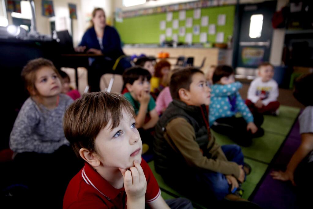 Kindergartners, including Owen Gallagher, 5, learn coding techniques from a online game in Mrs. Olufs' class at Penngrove Elementary School in Penngrove, California on Wednesday, December 10, 2014. (BETH SCHLANKER/ The Press Democrat)