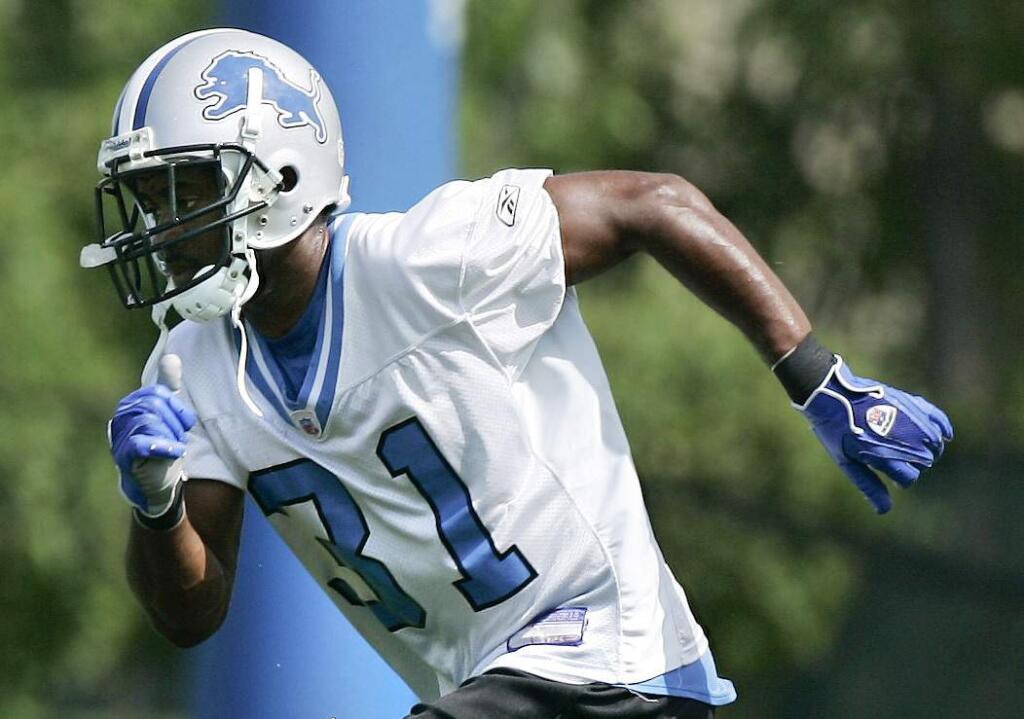 FILE - In this Aug. 7, 2006, file photo Detroit Lions' Stanley Wilson goes through running drills during the team's training camp at the training facility in Allen Park, Mich. Authorities say a homeowner in Portland, Oregon, shot an intruder who turned out to be former Detroit Lions cornerback Stanley Wilson II. The Multnomah County Sheriff's Office says Wilson tried to break through the back window of a multimillion-dollar home. Wilson has been arrested on charges of burglary and criminal trespass. (Daniel Mears /Detroit News via AP, File)