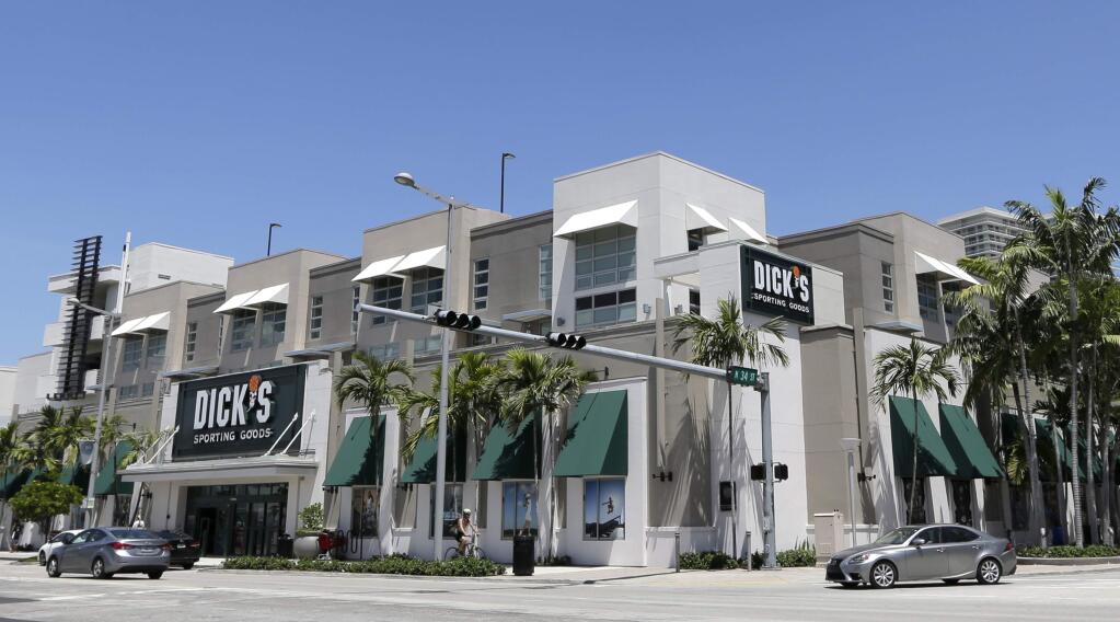 This photo taken Tuesday, Aug. 29, 2017, shows a Dick's Sporting Goods store in Miami. Dick's Sporting Goods announced Wednesday, Feb. 28, 2018, that it will immediately end sales of assault-style rifles and high capacity magazines at all of its stores and ban the sale of all guns to anyone under 21 years old. The announcement comes two weeks after the school massacre in Parkland, Fla. (AP Photo/Alan Diaz)