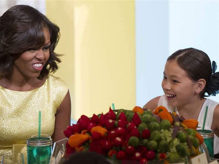 First Lady Michelle Obama talks with Amber Kelley of Washington during the 2013 Children's State Dinner for winners of the 'Healthy Lunchtime Challenge.' (Jim Watson / AFP - Getty Images)