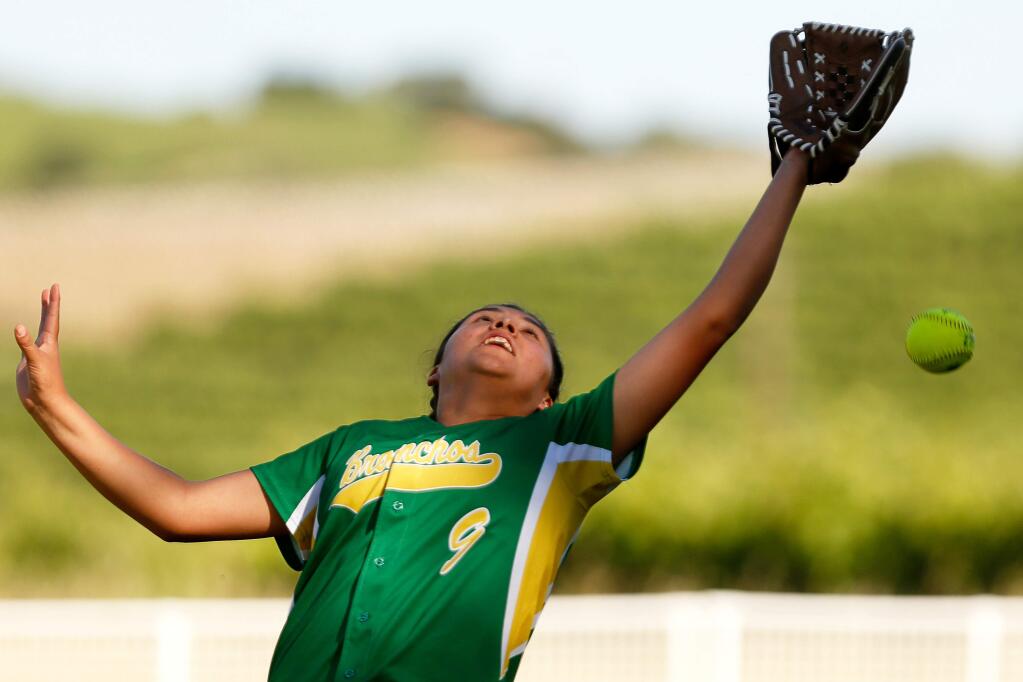 Geyserville's Maria Camacho (9) misjudges a pop fly ball that comes down over her head in shallow right field during the NCS Division 6 softball final game between Geyserville and South Fork high schools, in Geyserville, California, on Tuesday, May 29, 2018. (Alvin Jornada / The Press Democrat)