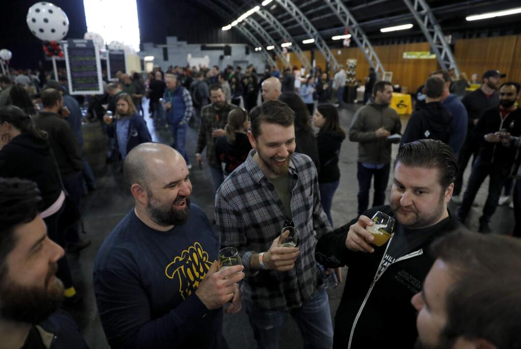 (From left) Friends Kyle Paul, Brando Oldham, Max Pachuta and Shane Olbourne during the RateBeer Best Beer Festival at the Grace Pavilion on the Sonoma County Fairgrounds on Saturday, January 14, 2017 in Santa Rosa, California . (BETH SCHLANKER/The Press Democrat)
