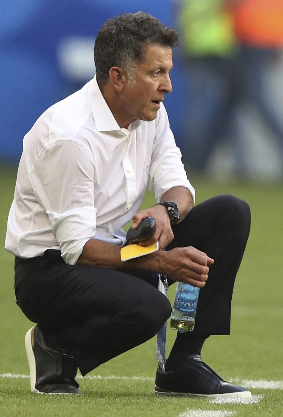 Mexico head coach Juan Carlos Osorio follows the action during the match between Brazil and Mexico at the 2018 World Cup in the Samara Arena, in Samara, Russia, Monday, July 2, 2018. (AP Photo/Thanassis Stavrakis)