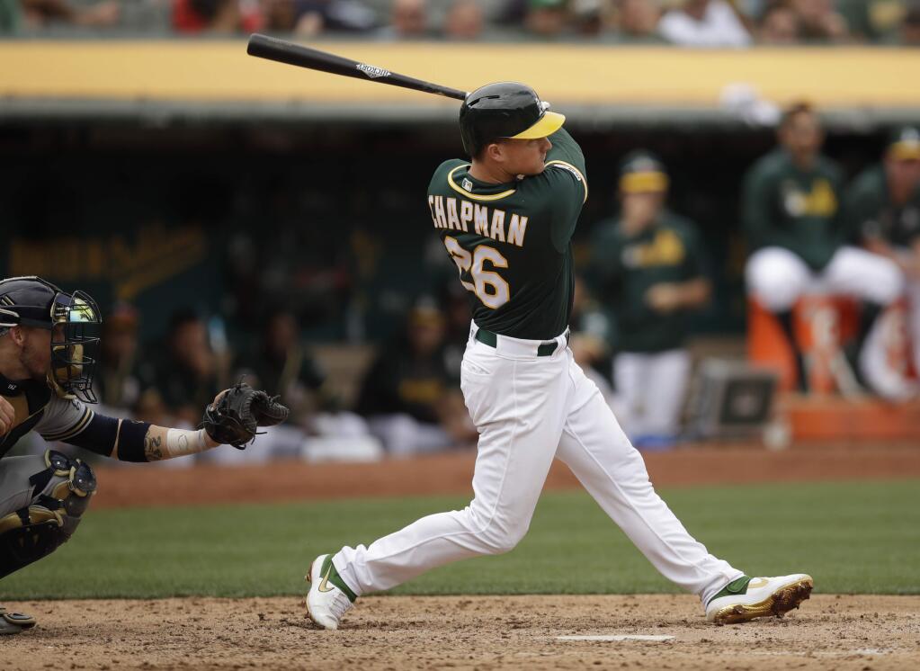 The Oakland Athletics' Matt Chapman swings for a two-run home run off the Milwaukee Brewers' Josh Hader in the eighth inning Thursday, Aug. 1, 2019, in Oakland. (AP Photo/Ben Margot)