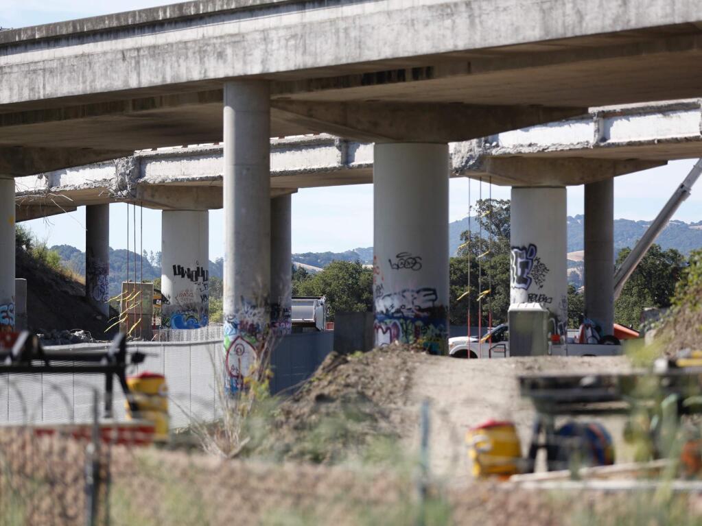 A man walking his bicycle along the SMART tracks north of the Southpoint Boulevard crossing in Petaluma was injured after being struck by a train on Thursday, June 11, 2020. (Beth Schlanker/The Press Democrat)