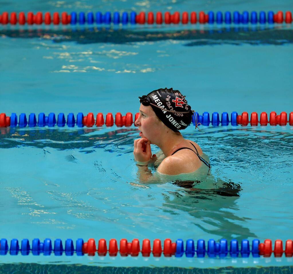 Megan Jones of Santa Rosa High School takes a breather after working out with Neptune Swimming, Thursday, May 3, 2018 at Santa Rosa Junior College in Santa Rosa. (Kent Porter / The Press Democrat)