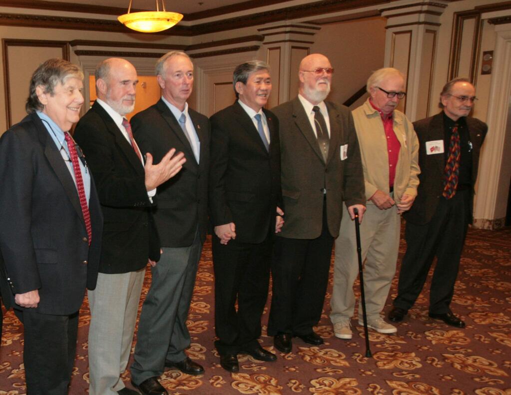 Fred Ptucha gestures as he and Dr. Bill Simon, far right and others pose with H.E. Dinh The Huynh, center, at a meeting on Saturday, Oct. 29, 2016 in San Francisco, Calif. Dinh is the executive secretary of party central committee of Vietnam and fought against American forces during the Vietnam War. (Photo/©Frankie Frost)