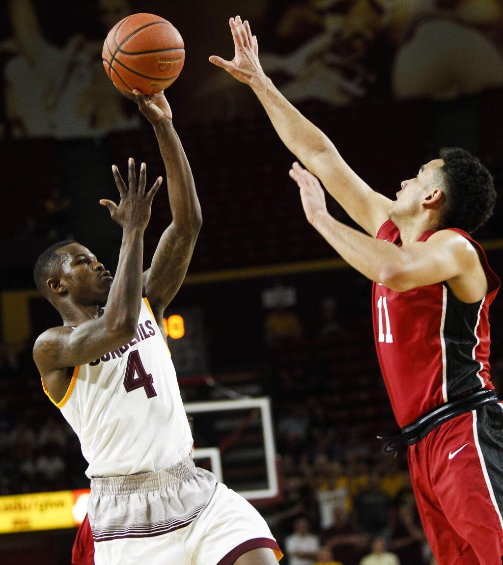 Arizona State's Gerry Blakes takes a shot as Stanfordís Dorian Pickens defends during an NCAA college basketball game Thursday, March 3, 2016, in Tempe, Ariz. (Danny Miller/The Arizona Republic via AP)