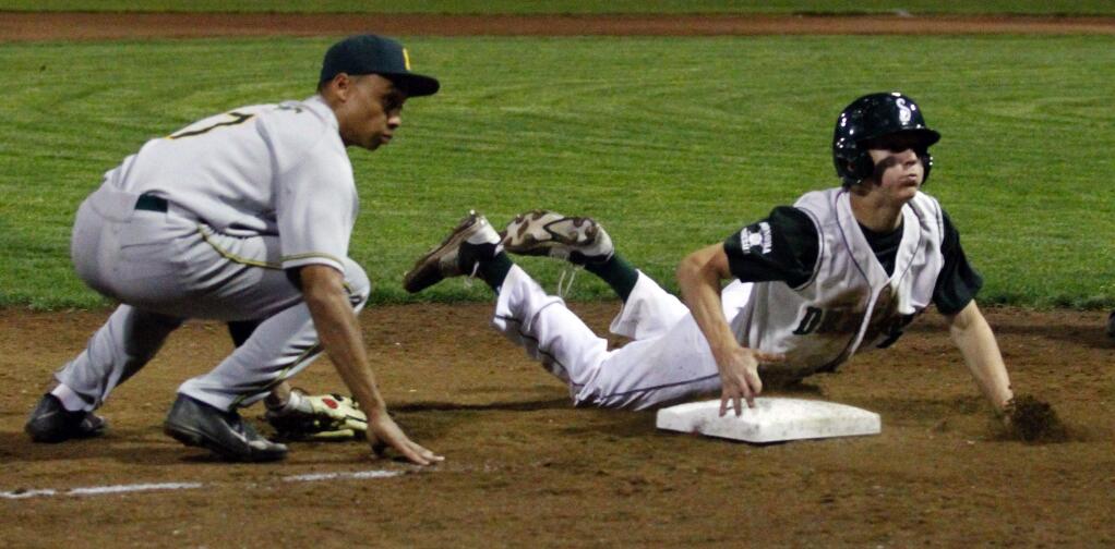 Bill Hoban/Index-TribuneSophomore Carson Snyder slides safely into third base during the Dragons' nonleague loss to San Marin Friday night at Arnold Field.