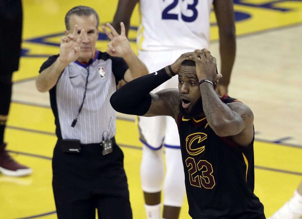 Cleveland Cavaliers forward LeBron James (23) reacts to a call during the second half of Game 1 of basketball's NBA Finals between the Golden State Warriors and the Cavaliers in Oakland, Calif., Thursday, May 31, 2018. (AP Photo/Marcio Jose Sanchez)