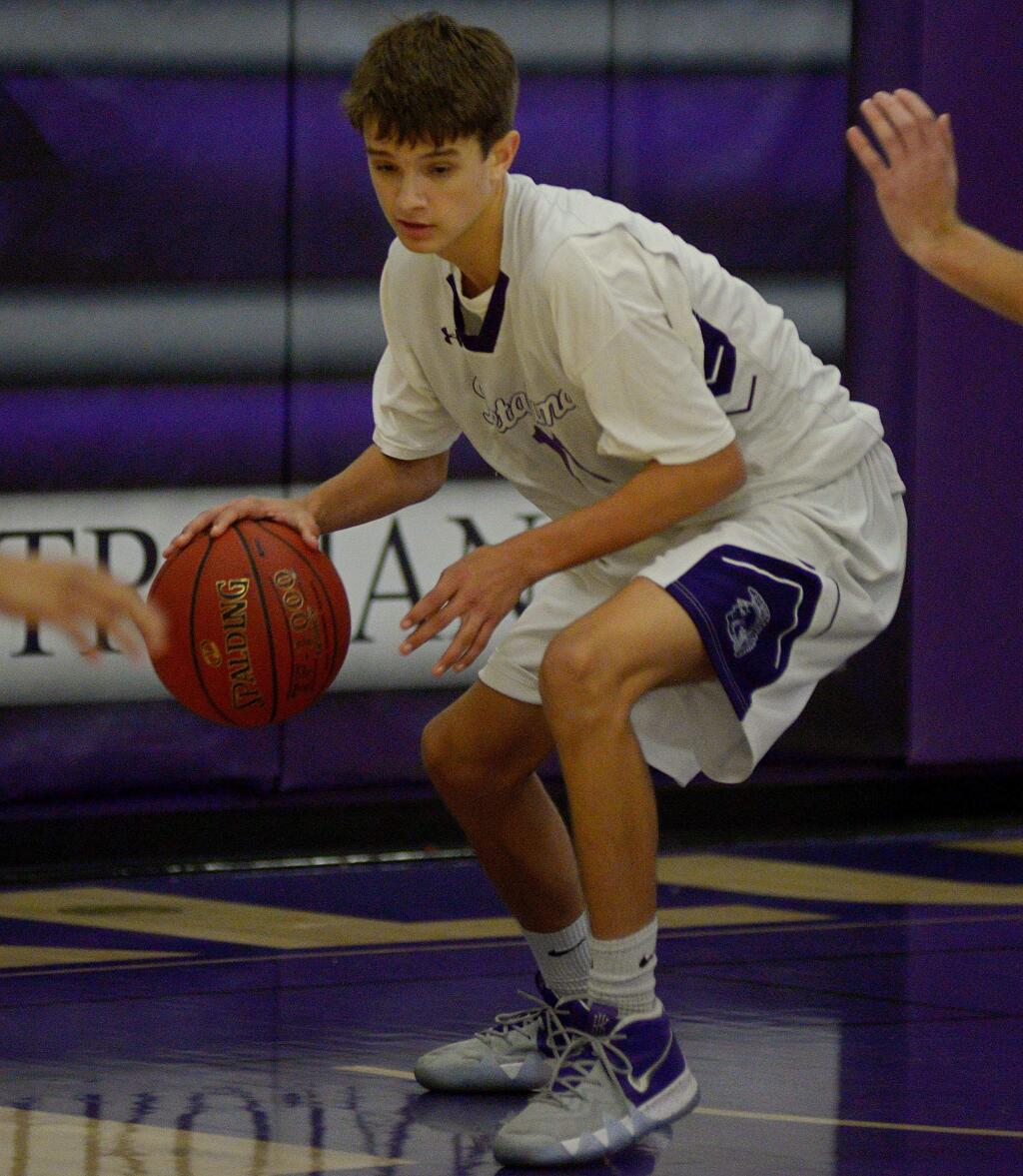 SUMNER FOWLER/FOR THE ARGUS-COURIERPetaluma's Ryan Giacomini made a miracle 4-point play to send the game into overtime and then hit another 3-point shot to lead the Trojan JVs to a 66-62 win over Casa Grande in the Wayne Douglas Junior Varsity Tournament.