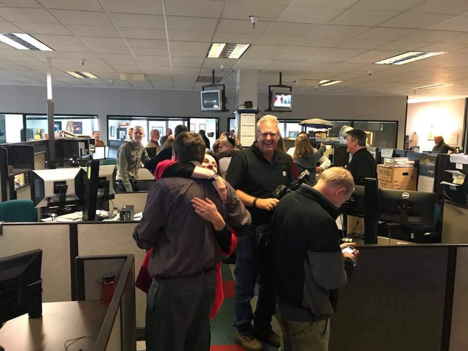 The Press Democrat news staff celebrates after learning they won the Pulitzer Prize for breaking news coverage of the October wildfires, Monday, April 16, 2018. (CRISSI LANGWELL / PRESS DEMOCRAT)
