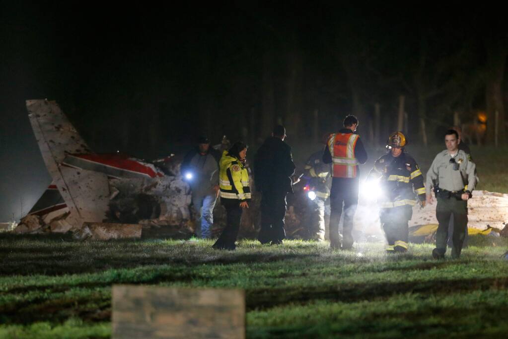 Sonoma County sheriff's deputies and Santa Rosa, Rincon Valley and Windsor firefighters respond to a fatal airplane crash off Wood Ranch Road in Santa Rosa, California, on Thursday, January 28, 2016. (Alvin Jornada / The Press Democrat)