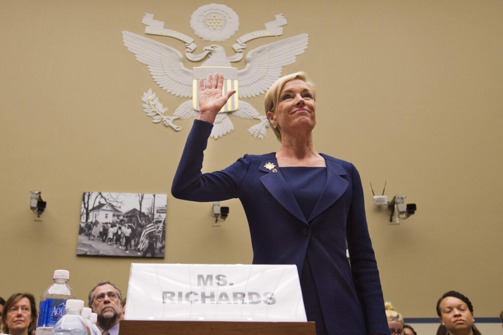 In this Tuesday, Sept. 29, 2015 photo, Planned Parenthood Federation of America President Cecile Richards is sworn in before testifying at a House Committee on Oversight and Government Reform Hearing on 'Planned Parenthood's Taxpayer Funding,' in Washington. Responding to a furor over undercover videos, Planned Parenthood said Tuesday, Oct. 13, 2015 it will maintain programs at some of its clinics that make fetal tissue available for research, but will no longer accept any sort of payment to cover the costs of those programs. (AP Photo/Jacquelyn Martin)