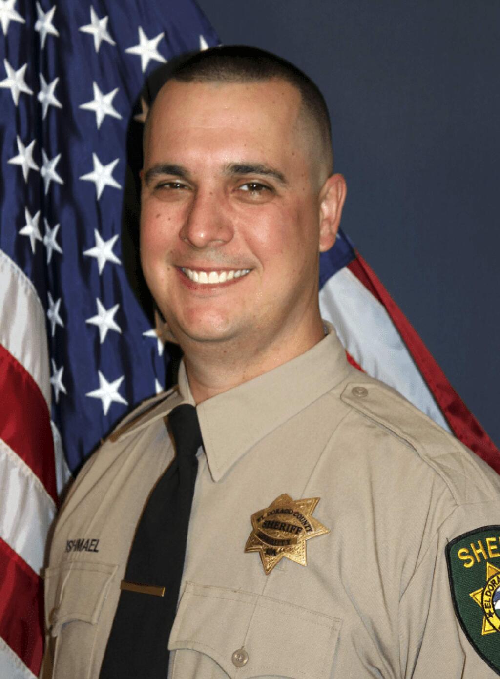 This undated photo provided by the El Dorado County Sheriff's Office shows Deputy Brian Ishmael. The Sheriff's office says Ishmael was fatally shot early Wednesday, Oct. 23, 2019 in the Sierra Nevada Foothills community of Somerset, Calif., and a ride-along passenger with him was injured. An office statement says two men were taken into custody but the scene about 45 miles east of Sacramento remains active. (El Dorado County Sheriff's Office via AP)