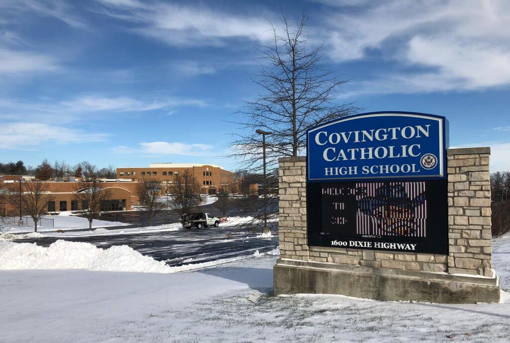 Snow covers the grounds of Covington Catholic High School in Park Hills, Ky., Sunday, Jan. 20, 2019. The school has received national attention in the wake of videos showing students from the school mocking Native Americans outside the Lincoln Memorial after a rally in Washington. (AP Photo/Lisa Cornwell)