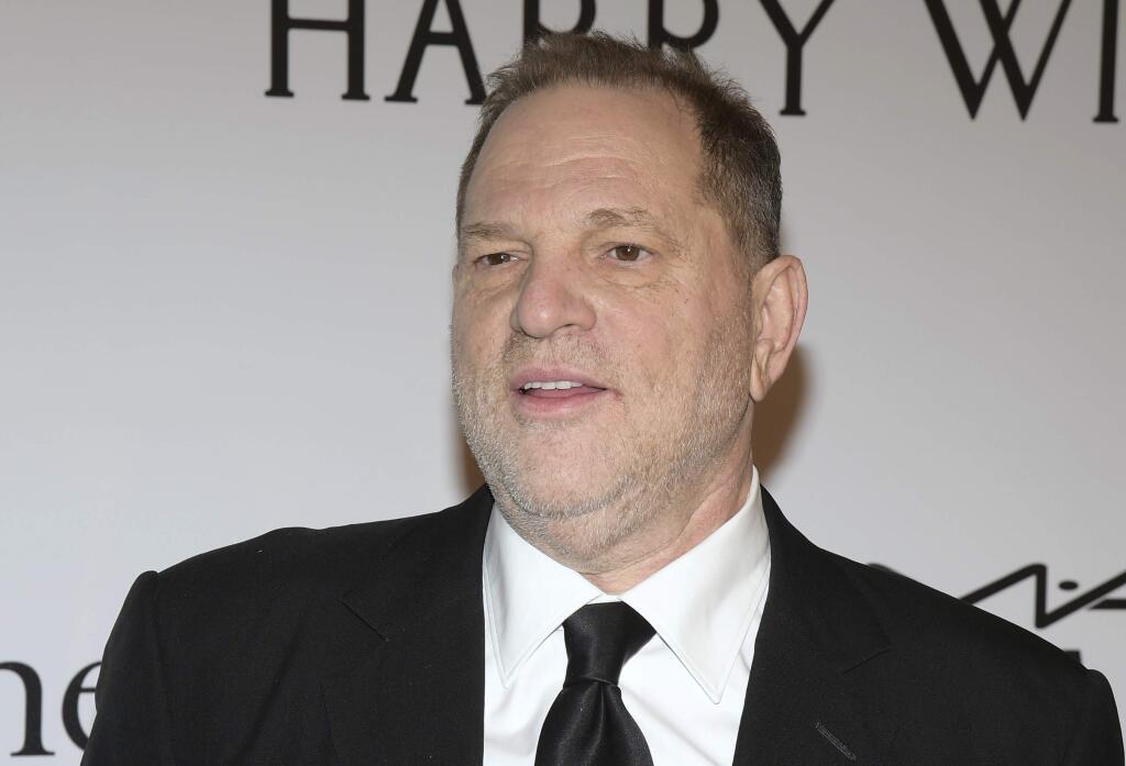 FILE - In this Feb. 10, 2016 file photo, Harvey Weinstein attends amfAR's New York Gala honoring Harvey Weinstein in New York. Weinstein is taking a leave of absence from his own company after The New York Times released a report alleging decades of sexual harassment against women, including employees and actress Ashley Judd. (Photo by Charles Sykes/Invision/AP, File)