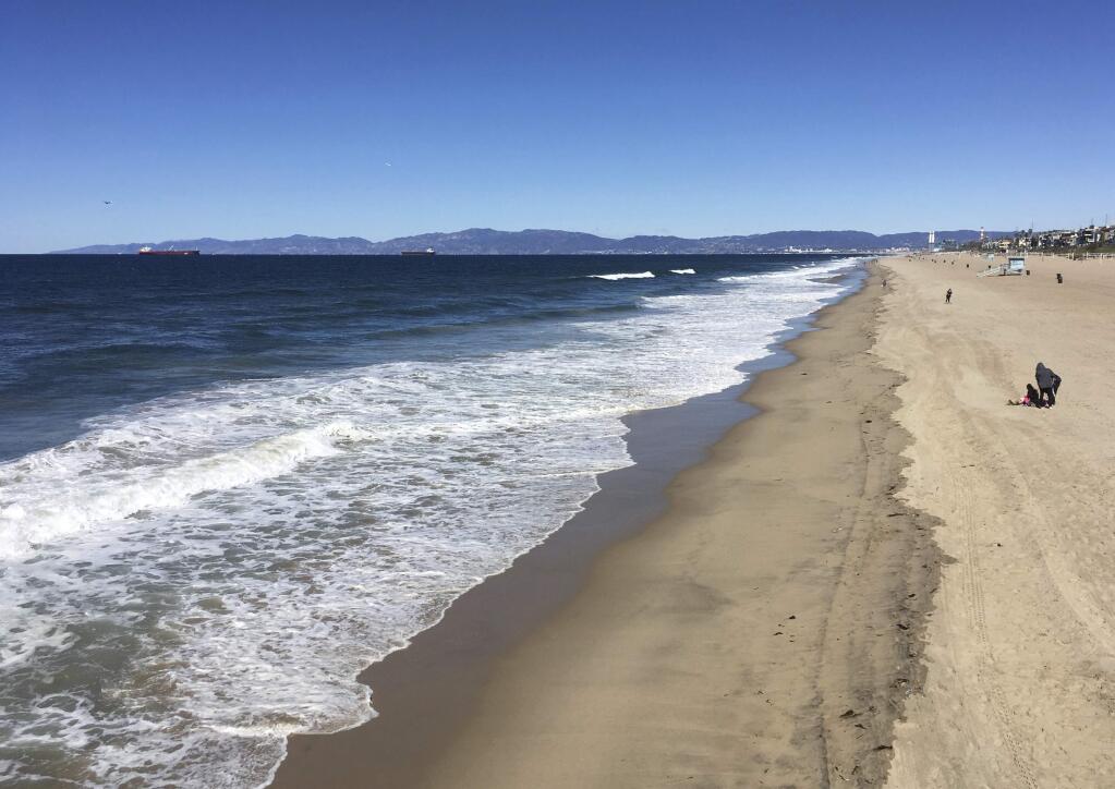 In this photo taken March 4, 2018, Santa Monica Bay is viewed from Manhattan Beach, Calif. An annual 'Beach Report Card,' released Thursday, June 7, 2018, concludes that low rainfall in California is resulting in less runoff and cleaner water along the coast. Heal The Bay said that a record 37 beaches statewide made its Honor Roll, meaning they are monitored year-round and score perfect A-plus grades each week. (AP Photo/John Antczak)