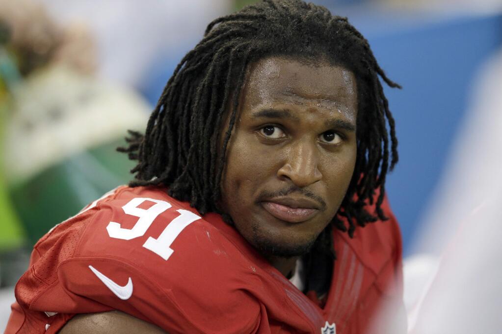 FILE - In this Sept. 7, 2014, file photo, San Francisco 49ers' Ray McDonald sits on the bench during the second half of an NFL football game against the Dallas Cowboys in Arlington, Texas. A Santa Clara County judge Monday, April 17, 2017, has dismissed a rape charge against former 49er McDonald after prosecutors said the woman who made the allegation refused to testify. (AP Photo/LM Otero, File)