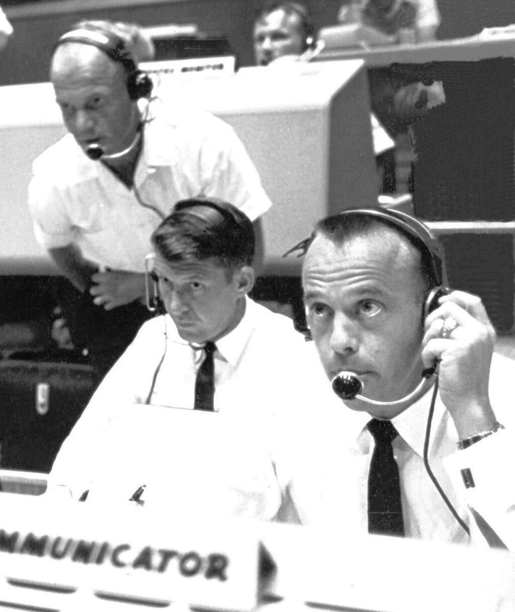 Controllers at Misson Control at NASA talk to Virgil Grissiom before the launch of Liberty Bell 7 July 21, 1961