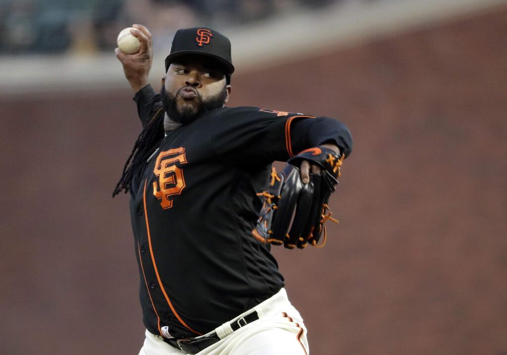 San Francisco Giants starting pitcher Johnny Cueto throws to the Oakland Athletics during the first inning of an exhibition game Thursday, March 30, 2017, in San Francisco. (AP Photo/Marcio Jose Sanchez)
