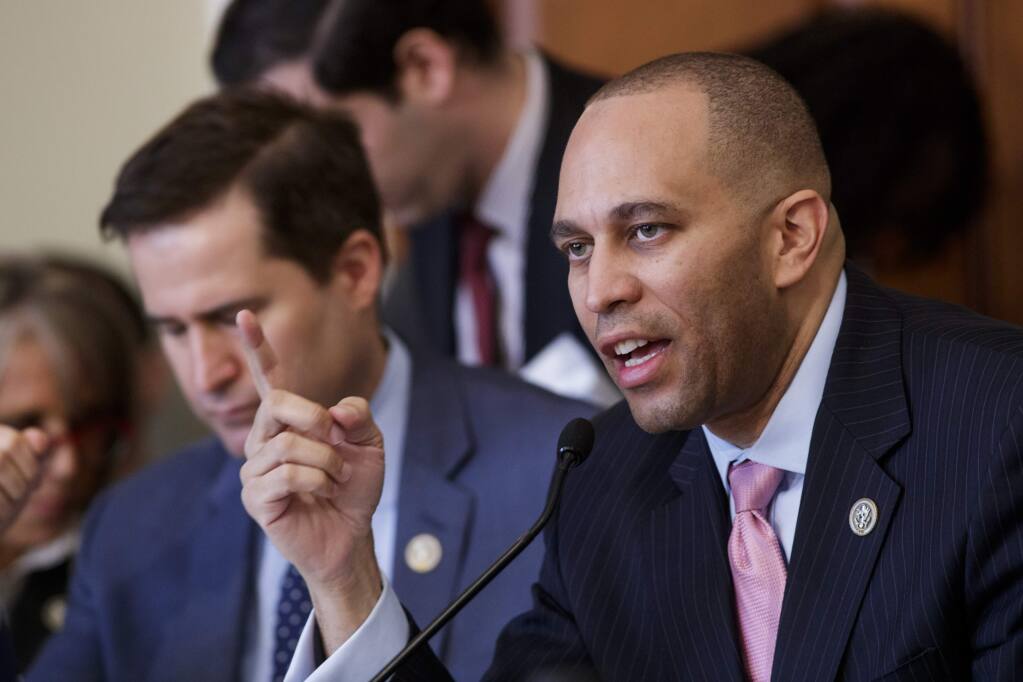 Rep. Hakeem Jeffries, D-N.Y., joined at left by Rep. Seth Moulton, D-Mass., speaks as he opposes the Republican health care bill during work by the House Budget Committee, on Capitol Hill in Washington, Thursday, March, 16, 2017. (AP Photo/J. Scott Applewhite)