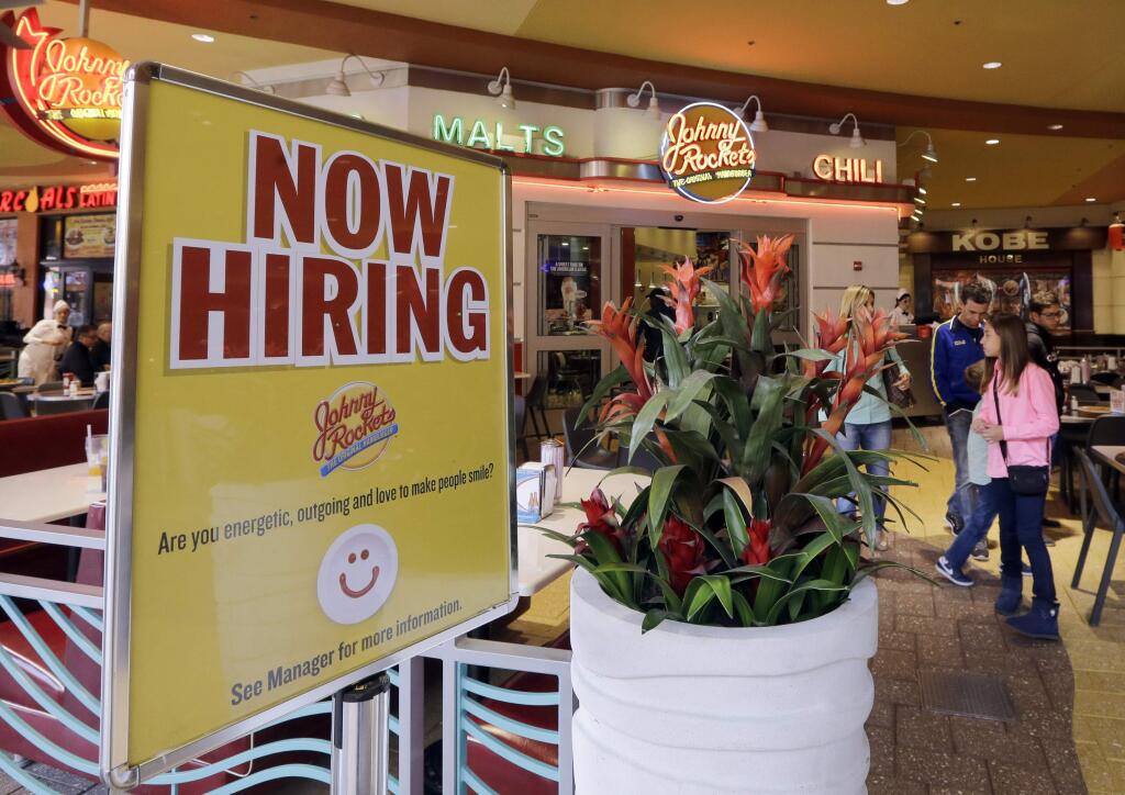 FILE - In this Tuesday, Feb. 9, 2016, file photo, a restaurant posts a sign indicating they are hiring, in Miami. (AP Photo/Alan Diaz, File)