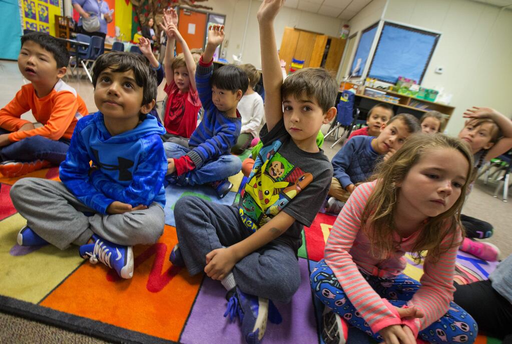 First graders in Tara Kellett's class are using the space formerly occupied by counselors at Hidden Valley Elementary school in Santa Rosa on Wednesday. (photo by John Burgess/The Press Democrat)