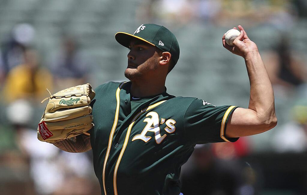 Oakland Athletics pitcher Sean Manaea works against the Kansas City Royals in the first inning of a baseball game Sunday, June 10, 2018, in Oakland, Calif. (AP Photo/Ben Margot)