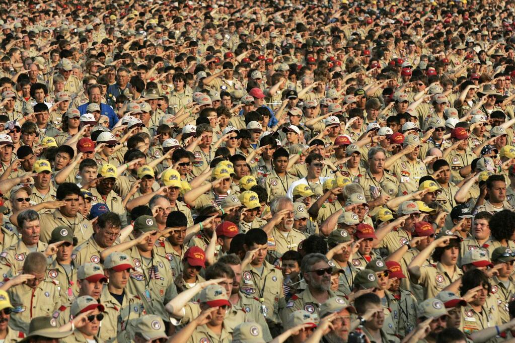 FILE - In this July 31, 2005 file photo, Boy Scouts salute as they recite the Pledge of Allegiance during the Boy Scout Jamboree in Bowling Green, Va. (AP Photo/ Haraz N. Ghanbari)