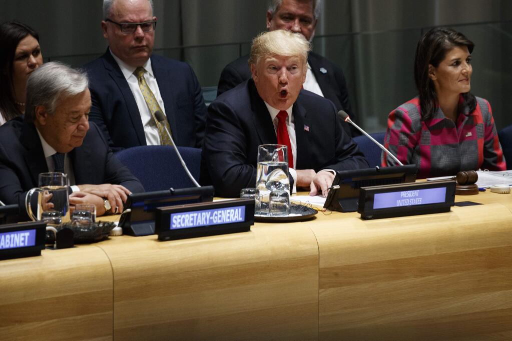 United Nations Secretary General Antonio Guterres, left, and U.S. Ambassador to the United Nations Nikki Haley, right, listen as President Donald Trump speaks during the 'Global Call to Action on the World Drug Problem' at the United Nations General Assembly, Monday, Sept. 24, 2018, at U.N. Headquarters. (AP Photo/Evan Vucci)