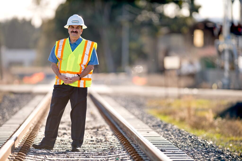 Farhad Mansourian, general manager of Sonoma-Marin Area Rail Transit, near the Adobe Lumber/Lagunitas Spur in Petaluma that serves local industry, freight, in December 2013. (Alvin A.H. Jornada / The Press Democrat)