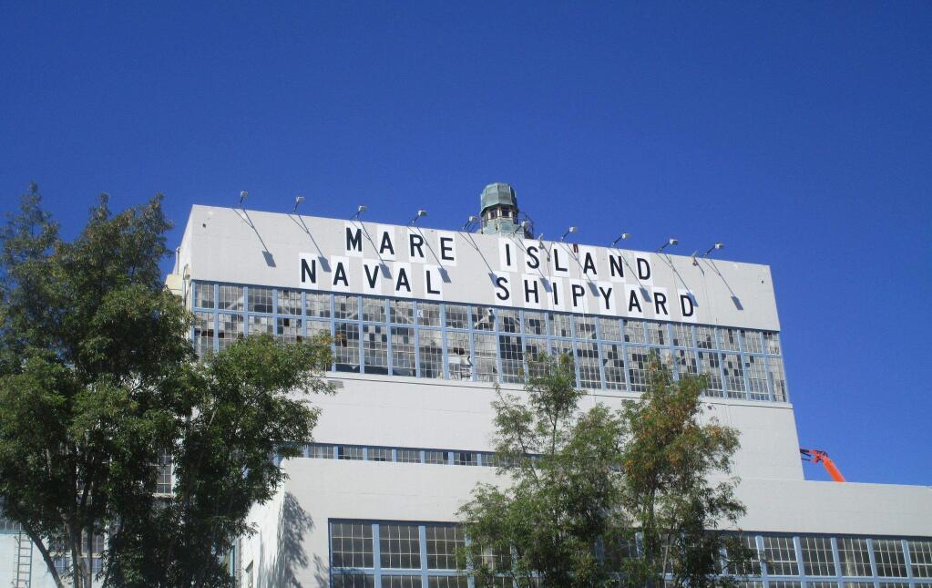 The exterior of Vallejo Mare Island's Building 680, the home of modular homebuilder Factory OS, seen here after the original Navy shipyard signage was refurbished in 2015. (courtesy of Keadjian Associates)
