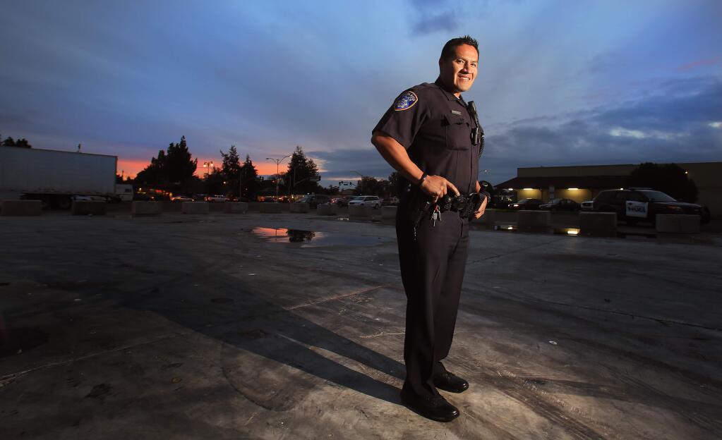 Santa Rosa police officer Orlando Macias, Tuesday Nov. 22, 2016 works the graveyard shift in the Rosalind area of Santa Rosa. Macias requested to work the shift so he could serve as a role model and protector for young people and is grateful for his role in the community. (Kent Porter / The Press Democrat) 2016