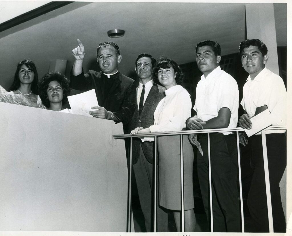 Monsignor Gerald Cox, third from left, and George Ortiz, fourth from left, with five students who received the first United Latins scholarships in 1962. [Courtesy California Human Development Corp.]