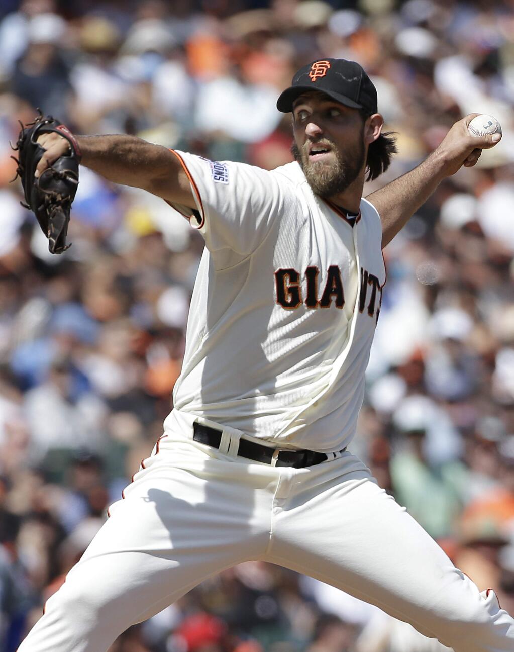 San Francisco Giants pitcher Madison Bumgarner throws against the Chicago Cubs during the sixth inning of a baseball game in San Francisco, Thursday, Aug. 27, 2015. (AP Photo/Jeff Chiu)
