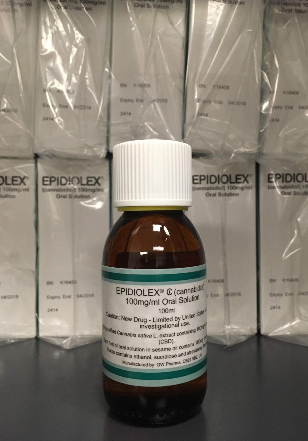 This Tuesday, May 23, 2017, photo shows GW Pharmaceuticals' Epidiolex, a medicine made from marijuana, but without TCH, in New York. According to a study published Wednesday by the New England Journal of Medicine the medicine cut seizures in kids with a severe form of epilepsy, which strengthens the case for more research into pot's possible health benefits. (AP Photo/Kathy Young)