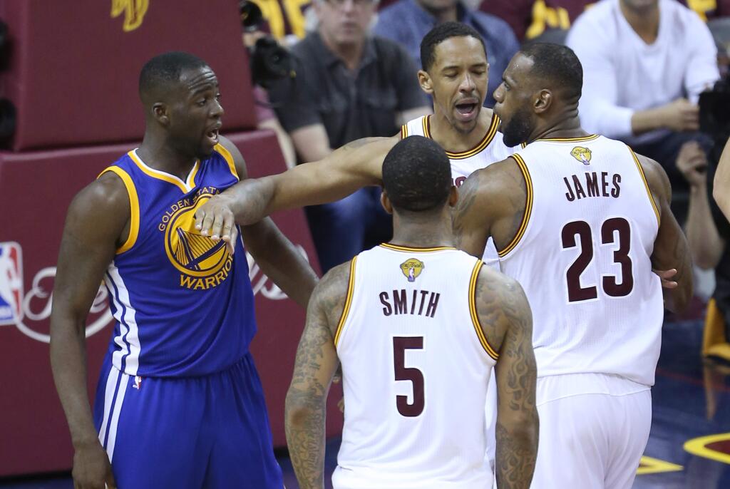 Golden State Warriors' Draymond Green and Cleveland Cavaliers' LeBron James get into an argument during their game in Cleveland on Friday, June 10, 2016. The Warriors defeated the Cavaliers 108-97. (Christopher Chung/ The Press Democrat)