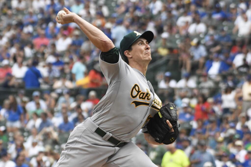 Oakland Athletics starting pitcher Homer Bailey (15) throws the ball against the Chicago Cubs during the first inning of a baseball game, Wednesday, Aug. 7, 2019, in Chicago. (AP Photo/David Banks)