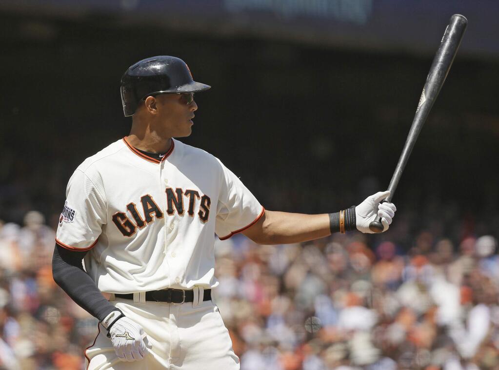 In this May 6, 2015, photo, San Francisco Giants' Justin Maxwell bats during a baseball game against the San Diego Padres in San Francisco. Journeyman Maxwell has proven a reliable replacement for injured Giants right fielder Hunter Pence. And he has had his wife and three children along for every moment of it, given that Loren Maxwell is home-schooling their oldest son for the second half of his kindergarten year so they can all stay together as a family. (AP Photo/Eric Risberg)