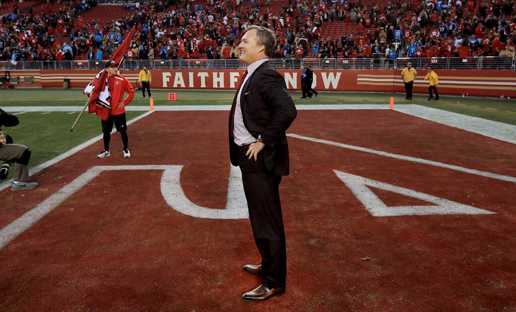 San Francisco general manager John Lynch waits to congratulate the 49ers after they beat the Titans Sunday Dec. 17, 2017 in Santa Clara. (Kent Porter / The Press Democrat)
